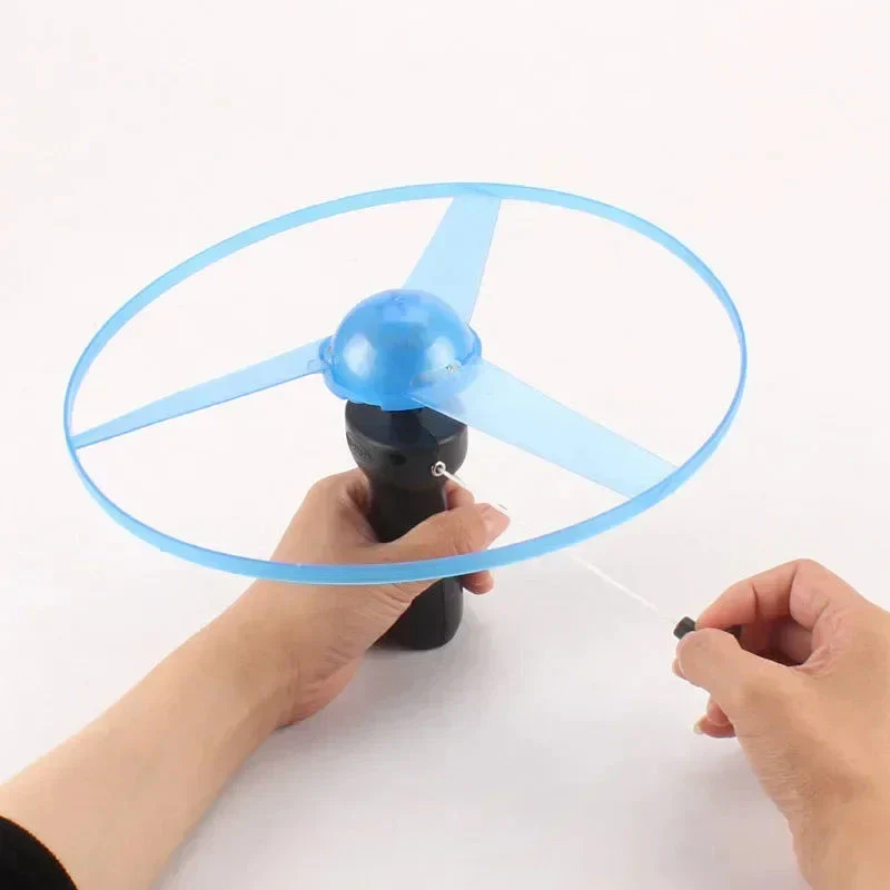 Pull Wire Glow UFO – Spinning LED Flyer Toy for Kids Outdoor Fun - Image 4
